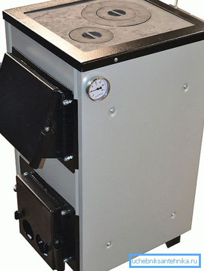 Kuvassa - 15 kW: n kiinteän polttoaineen kattila Kuvassa - 15 kW: n kiinteän polttoaineen kattila